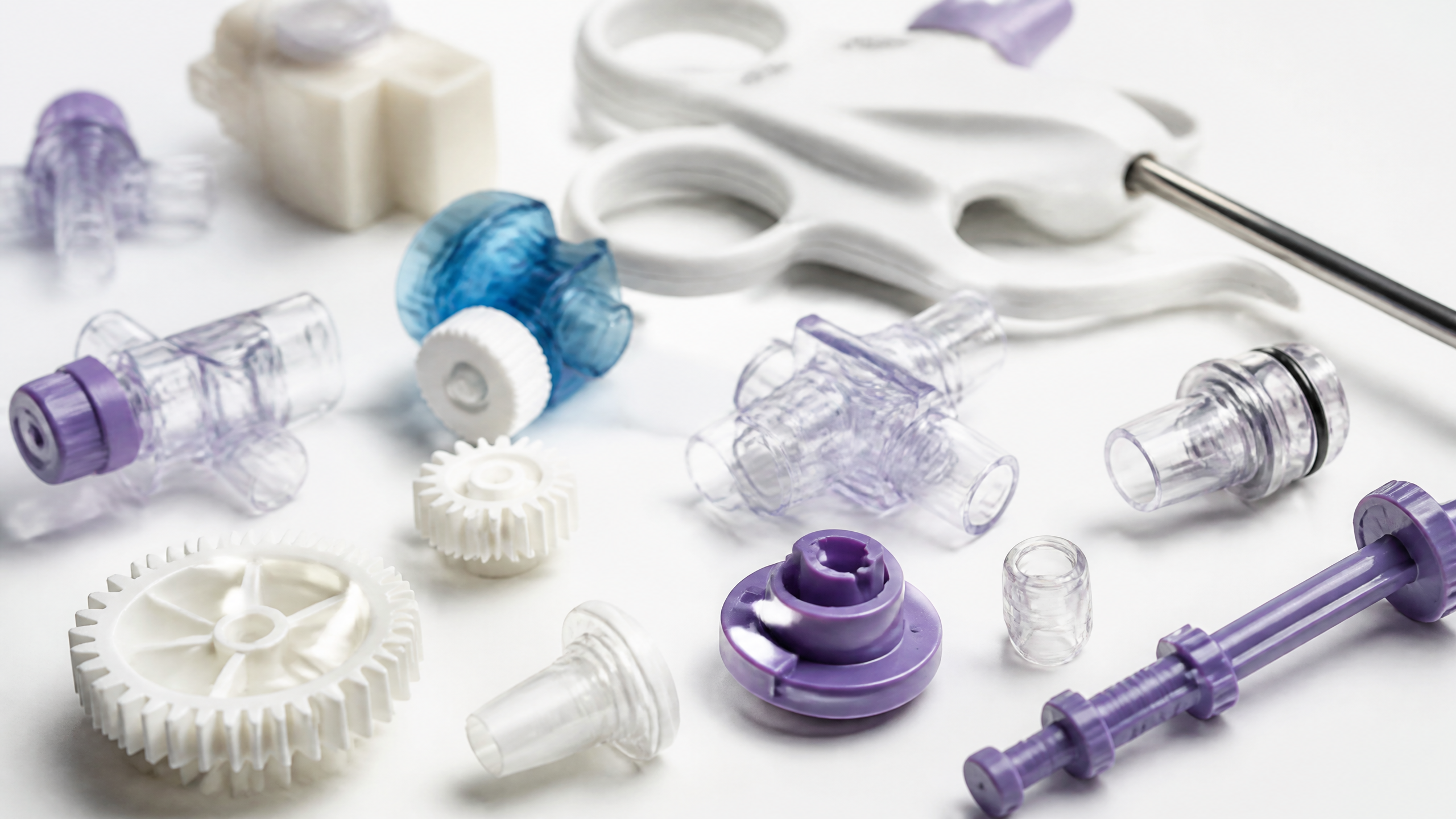 Medical injection molded precision parts including gears connectors and valve components